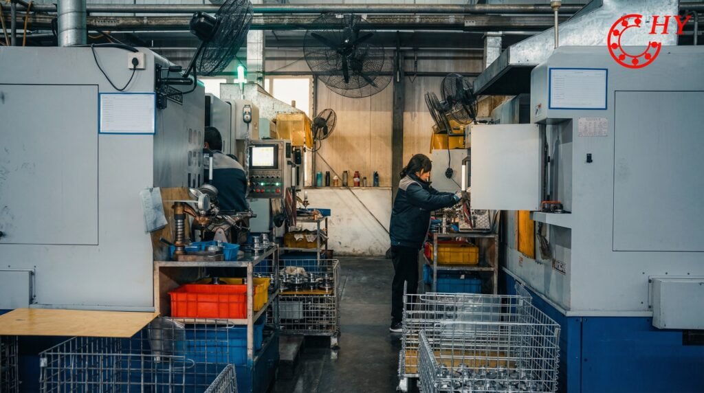 A close-up view of technicians operating sophisticated CNC equipment