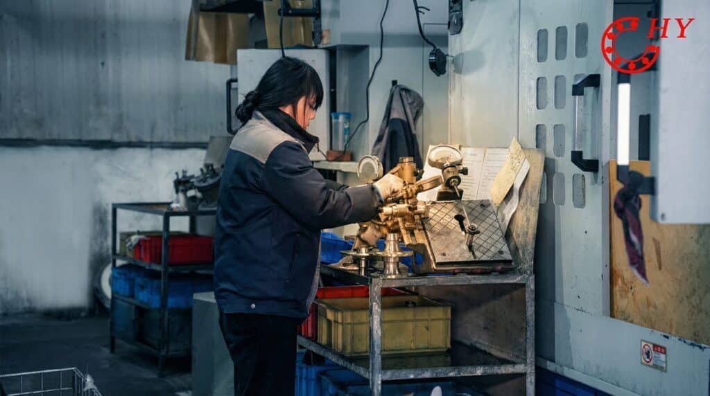 The scene where employees use precise measuring tools for quality inspection