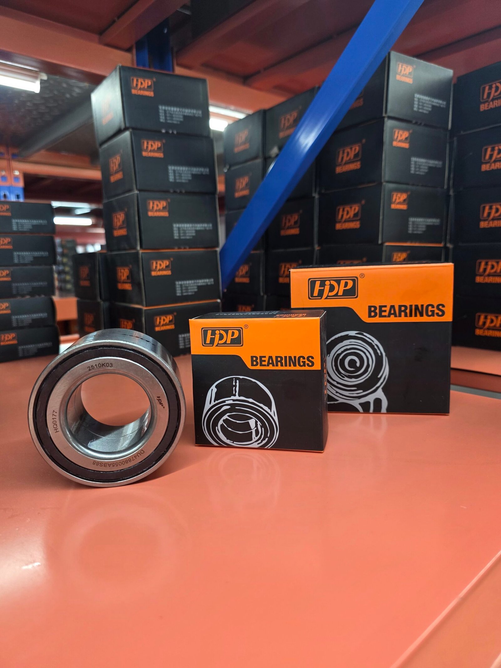 What Is the Automotive Wheel Hub Bearing Aftermarket Market? 6 Wheel hub bearing units arranged on a parts distribution counter in a warehouse